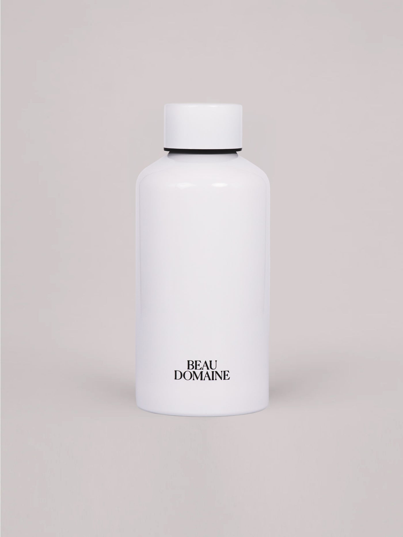 White bottle with 'Beau Domaine' branding on a beige background